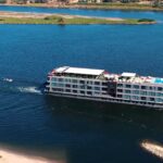 Historia Boutique Hotel Nile Cruise sailing on the Nile River in Egypt with panoramic countryside views, book with Nile Cruisen.