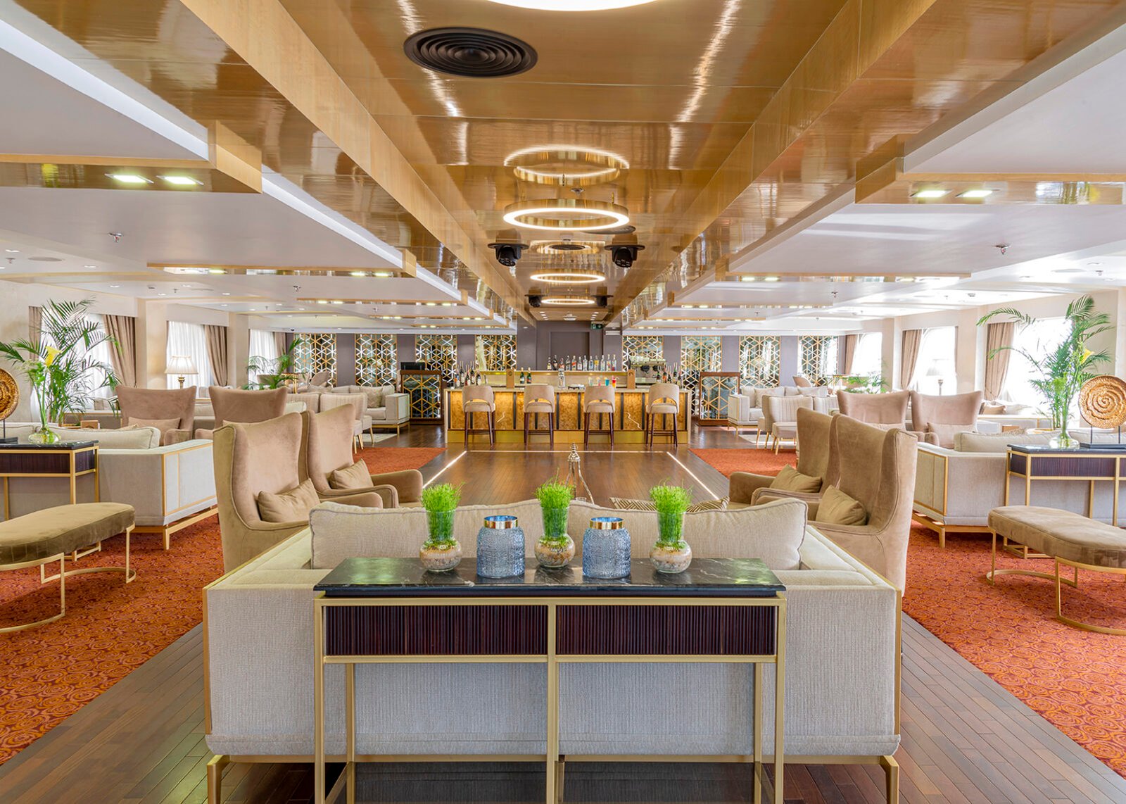 The luxurious and fully stocked main bar on the Sonesta Sun Goddess Nile cruise, ready to serve an extensive selection of drinks