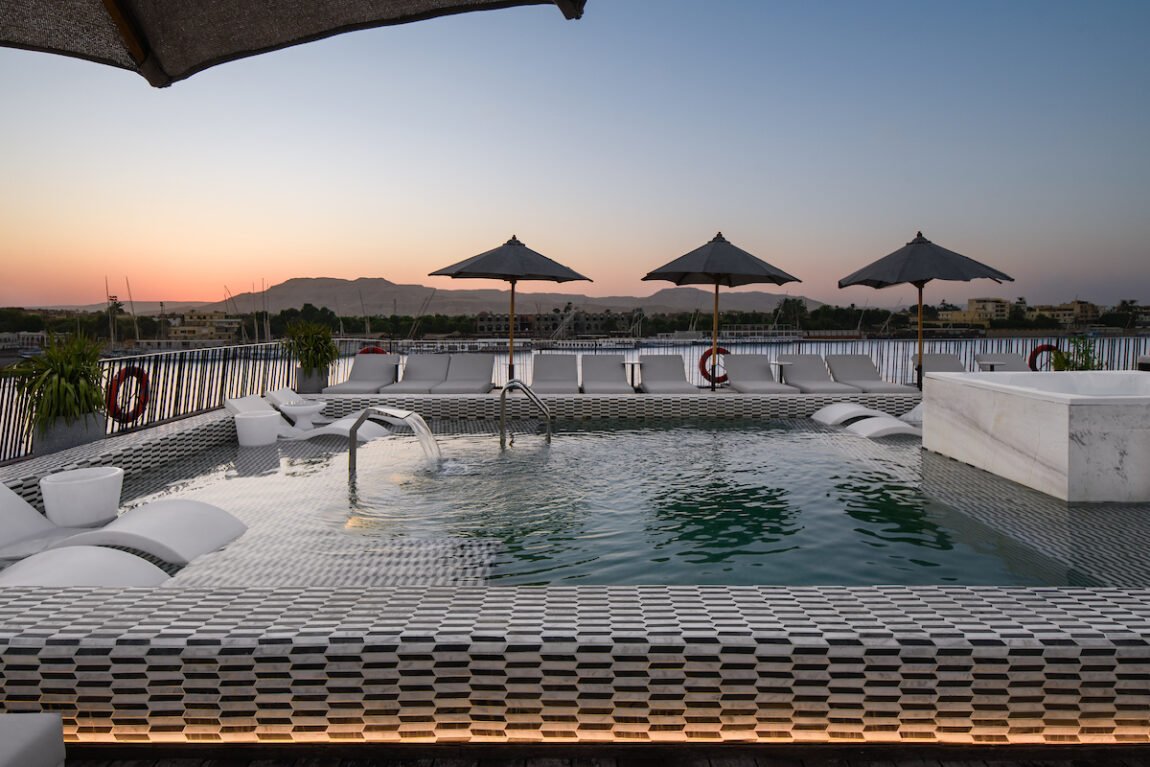 The sundeck swimming pool on the MS Le Soleil luxury Nile cruise, with lounge chairs ready for guests.