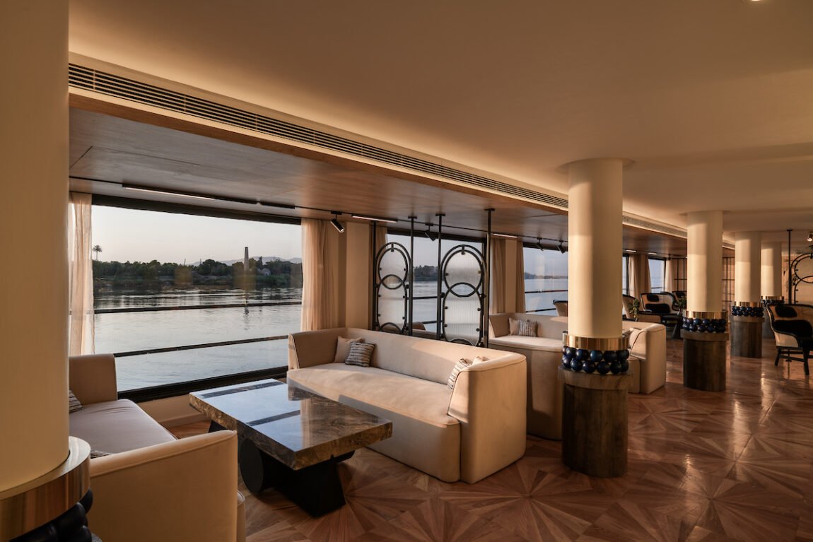 he elegant main restaurant of the Soleil Nile Cruise, featuring beautifully set dining tables ready for guests, with ambient lighting creating a luxurious atmosphere.