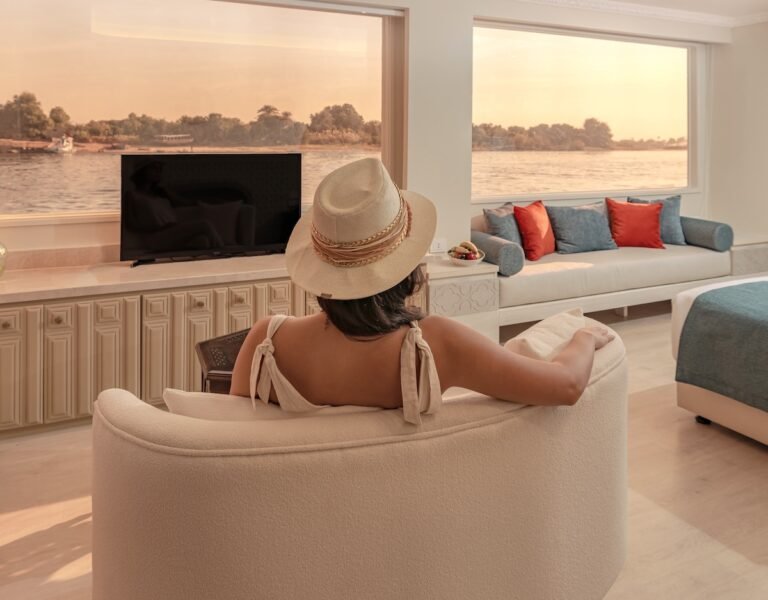 Peaceful meditation on board Nawara Dahabiya as it sails quietly along the Nile, surrounded by calm waters and serene landscapes.