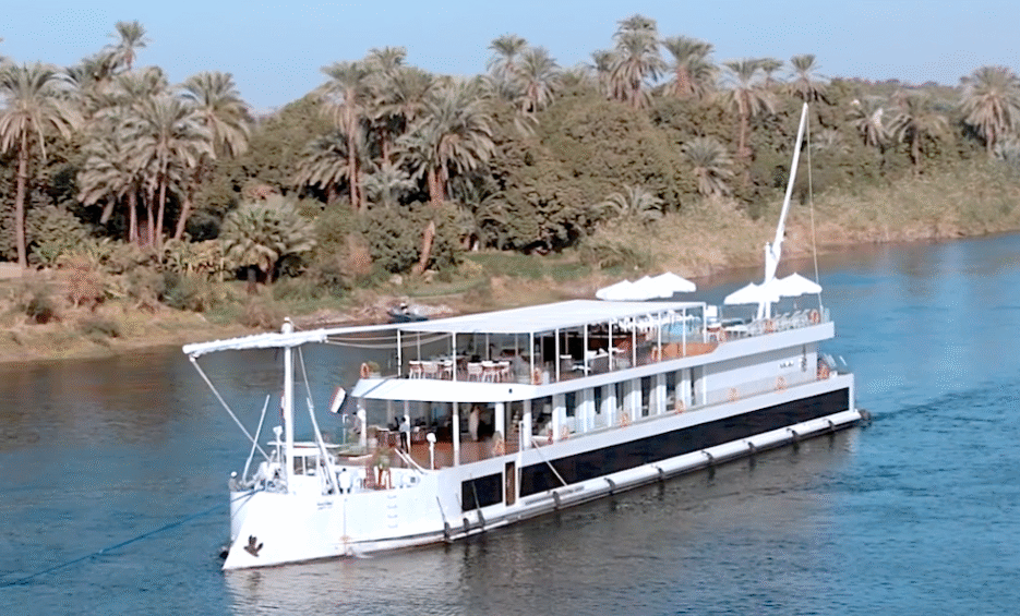 Nawara Dahabiya exterior sailing on the Nile River with traditional sails