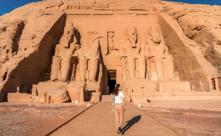 Travelers visiting Abu Simbel Temple during a Nile cruise excursion in Egypt