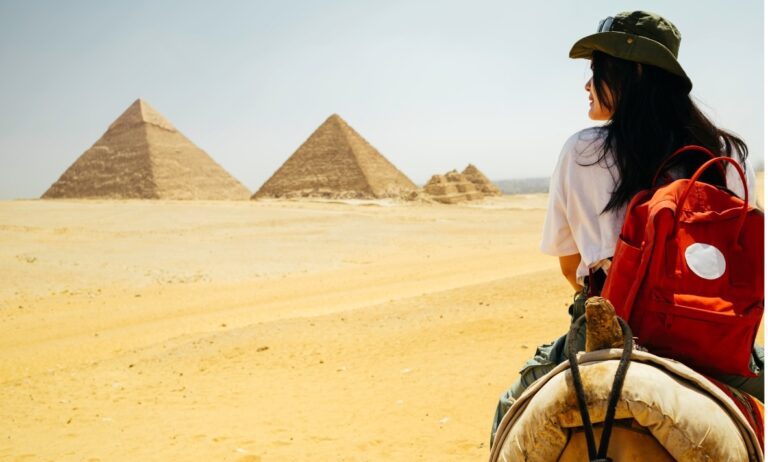 Tourists exploring the Great Pyramids of Giza with Nile Cruisen travel agent in Egypt