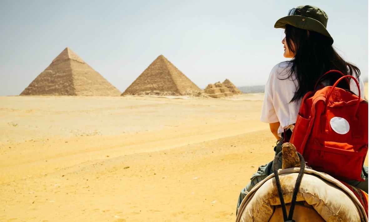 Tourists exploring the Great Pyramids of Giza with Nile Cruisen travel agent in Egypt
