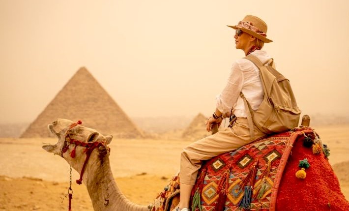 The Great Pyramids of Giza in Egypt under a clear blue sky near Cairo.