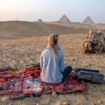 Camel ride in front of the Giza Pyramids during a Nile Cruisen Egypt tour