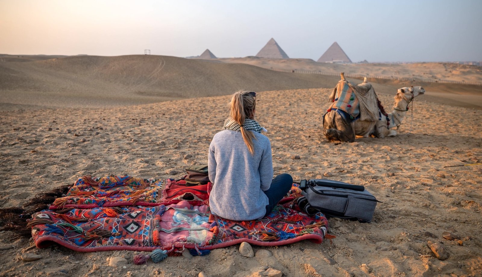Camel ride in front of the Giza Pyramids during a Nile Cruisen Egypt tour