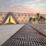 Grand Egyptian Museum in Giza Egypt with tourists enjoying a guided visit by Nile Cruisen