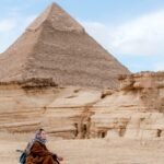 Meditation session at the Giza Pyramids with a peaceful desert atmosphere during a spiritual Egypt tour by Nile Cruisen.