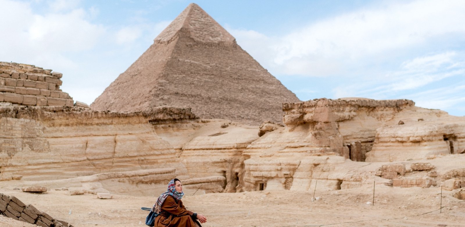 Meditation session at the Giza Pyramids with a peaceful desert atmosphere during a spiritual Egypt tour by Nile Cruisen.