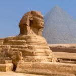 The Great Sphinx of Giza in Egypt during sunset with tourists visiting as part of a Nile Cruisen tour