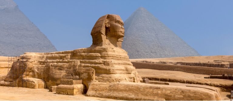 The Great Sphinx of Giza in Egypt during sunset with tourists visiting as part of a Nile Cruisen tour