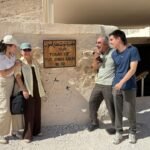 Happy travelers enjoying a luxury Nile cruise in Egypt with Nile Cruisen, relaxing on deck while admiring the scenic Nile River and ancient Egyptian landscapes.