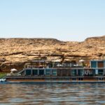 Small luxury river Nile cruise sailing between Luxor and Aswan in Egypt with elegant cabins and scenic Nile views.