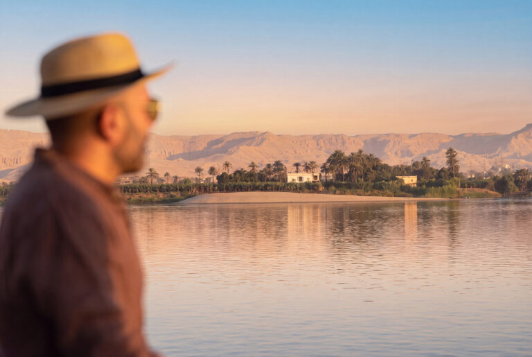 Smiling guest enjoying a luxury Nile cruise and Egypt tour with Nile Cruisen.