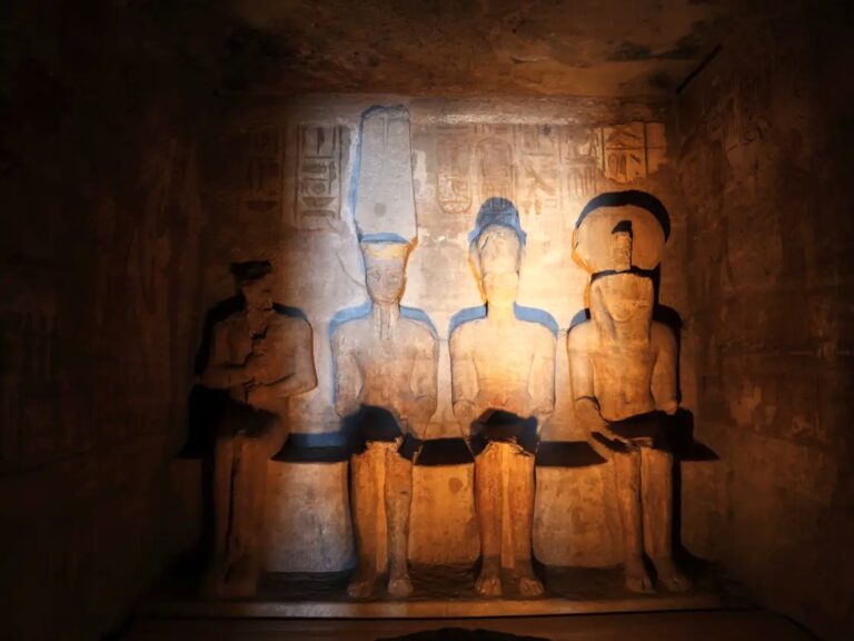 Sunlight illuminating the statue of Ramesses II inside the Great Temple of Abu Simbel